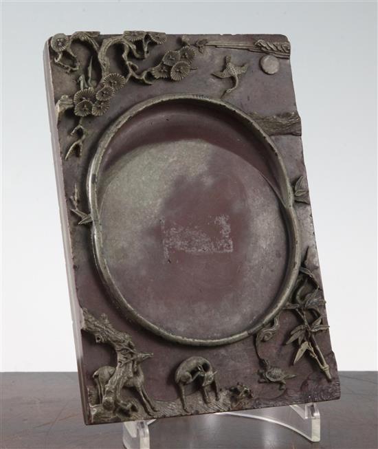 A Chinese two colour slate inkstone, 19th century, 20cm x 13.5cm